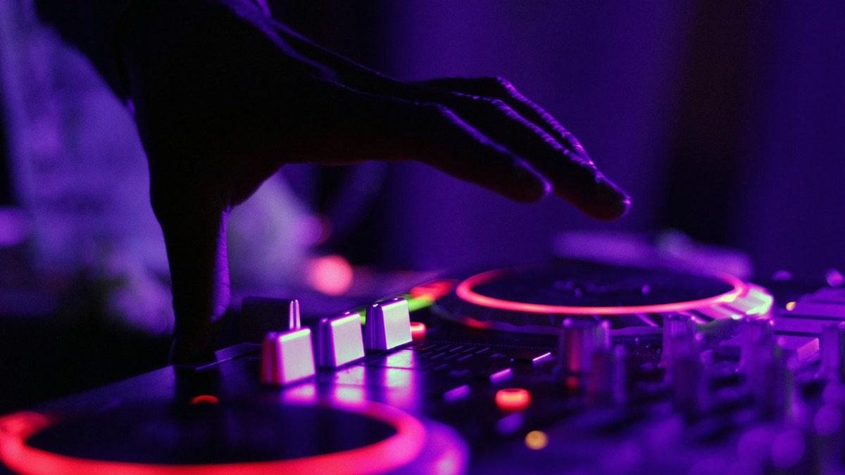 DJ hands over music mixer