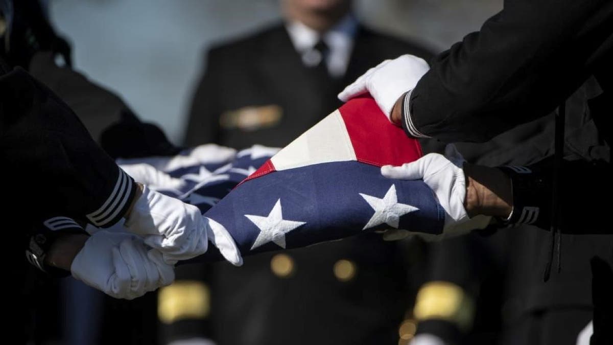 Sailors holding American flag