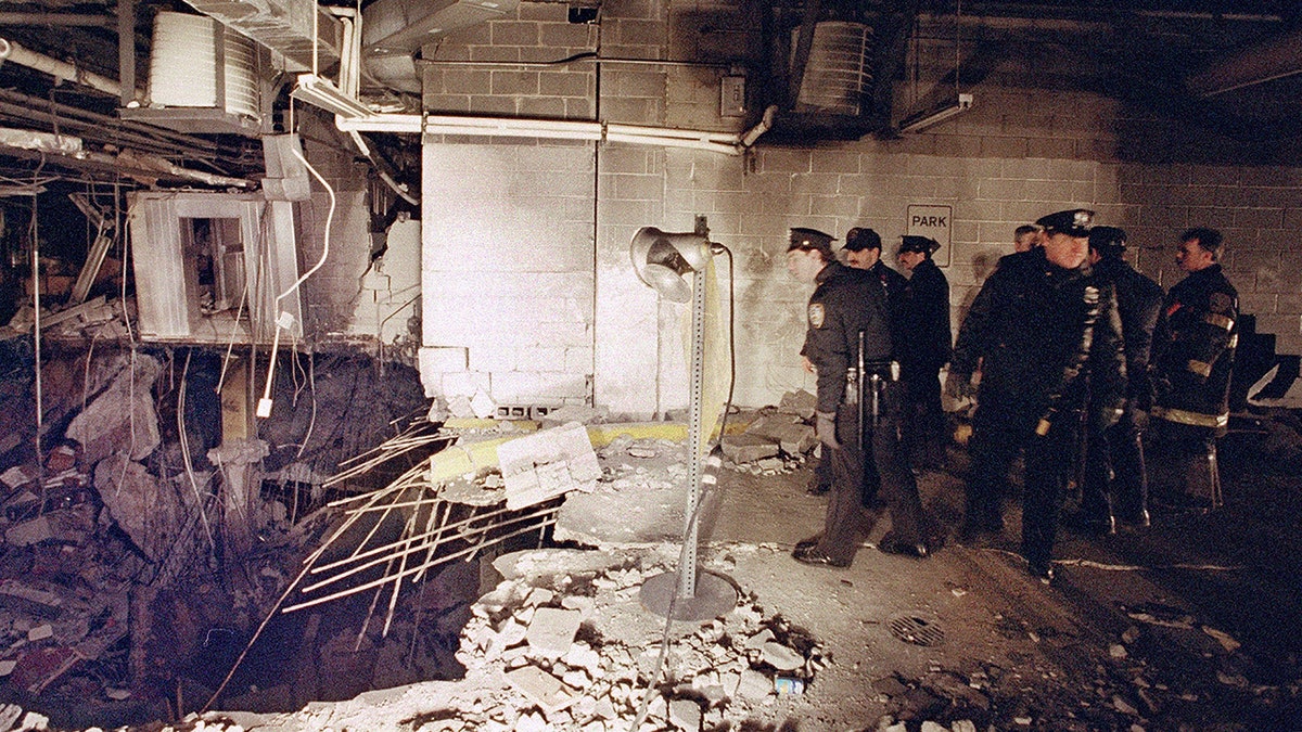 police around bomb crater