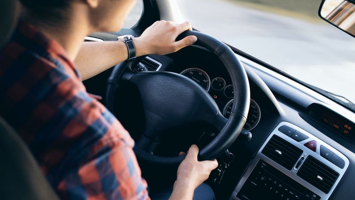 Photo of a woman driving her car.