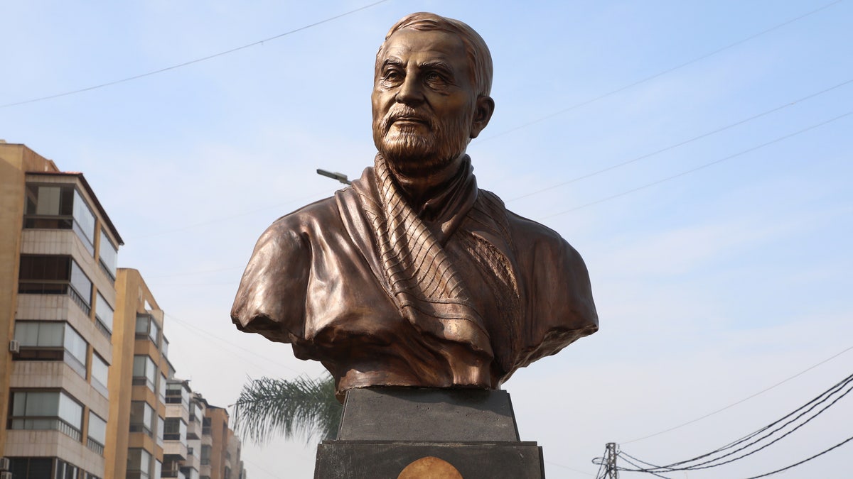 A statue of Iranian commander Qassem Soleimani, is erected to mark a year since his killing in a U.S. attack, at Beirut suburbs