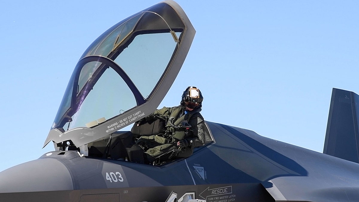 A pilot in the cockpit of a plane