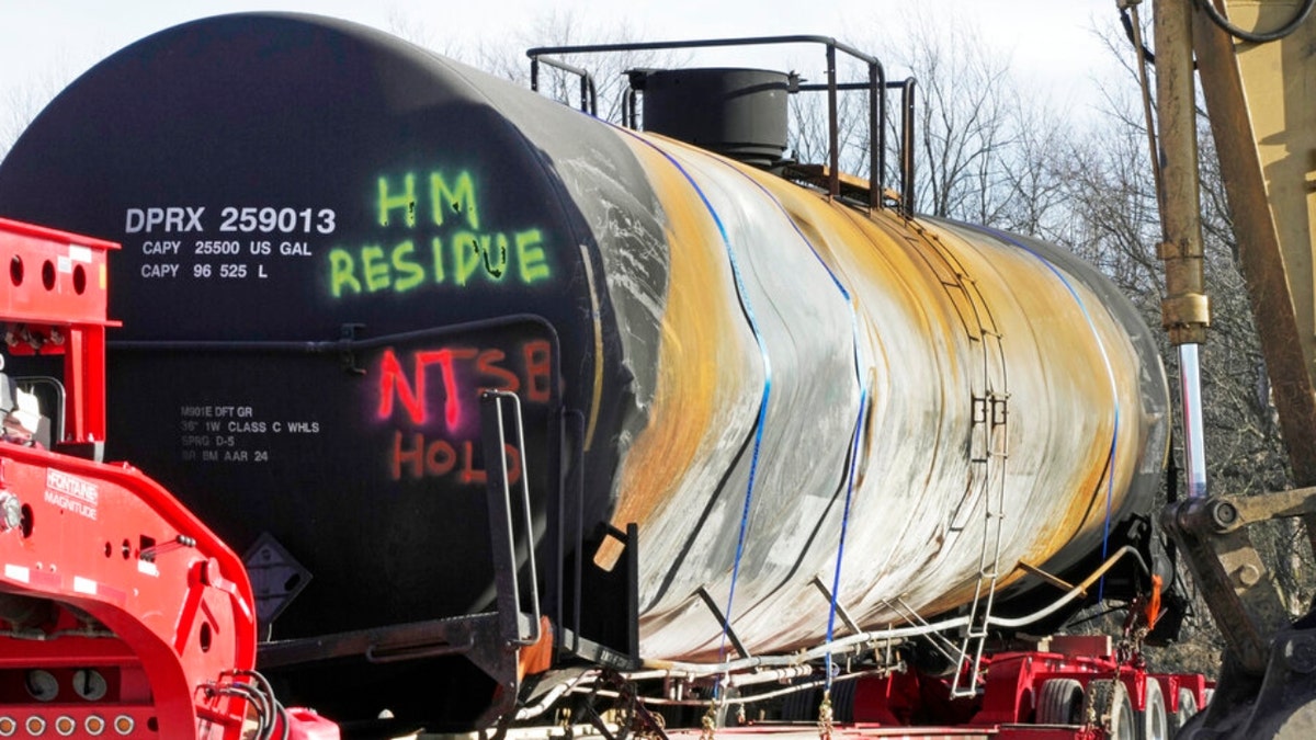 A tank car sits on a trailer in East Palestine