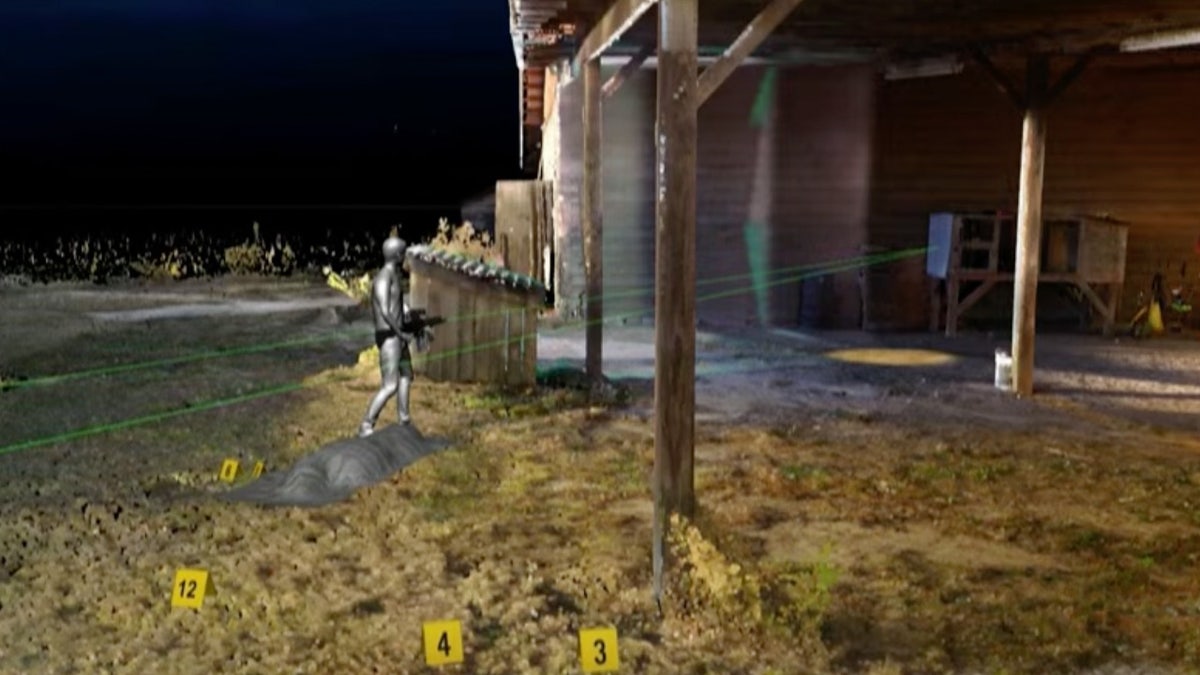 Gray man holding a .300 Blackout rifle in crime scene recreation.