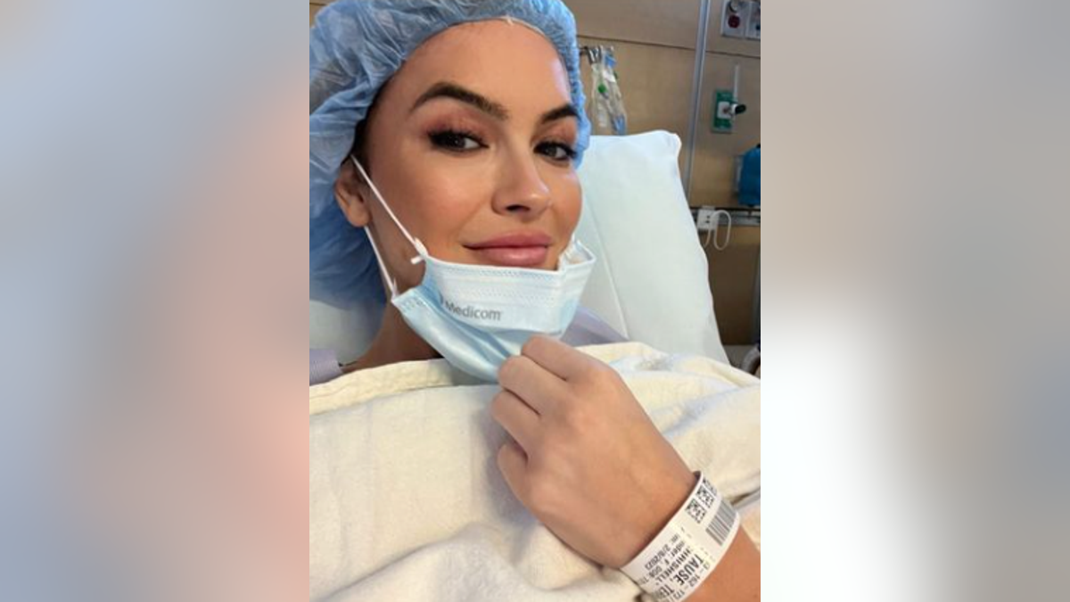 Chrishell Stause in hospital bed