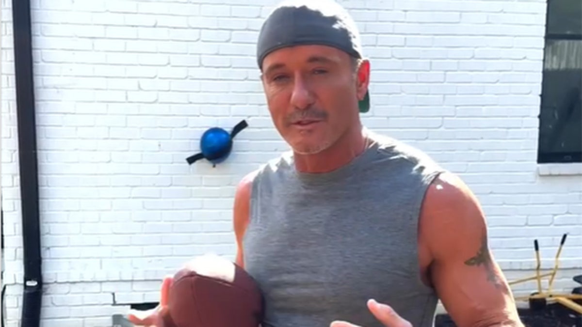 Tim McGraw playing football