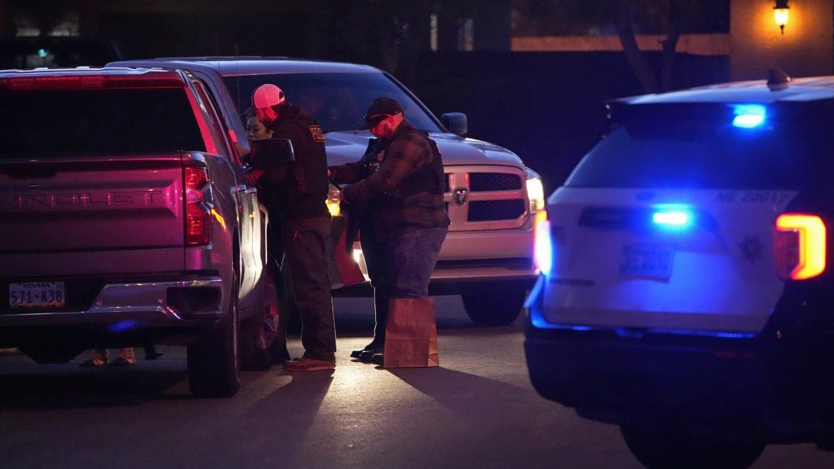 Las Vegas police work near the home of former actor Nathan Lee Chasing His Horse