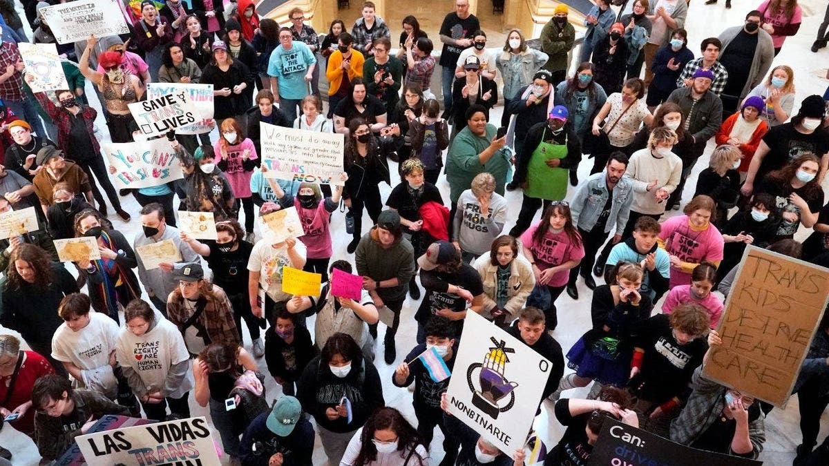 Trans-rights activists protest outside the Okla. House chamber