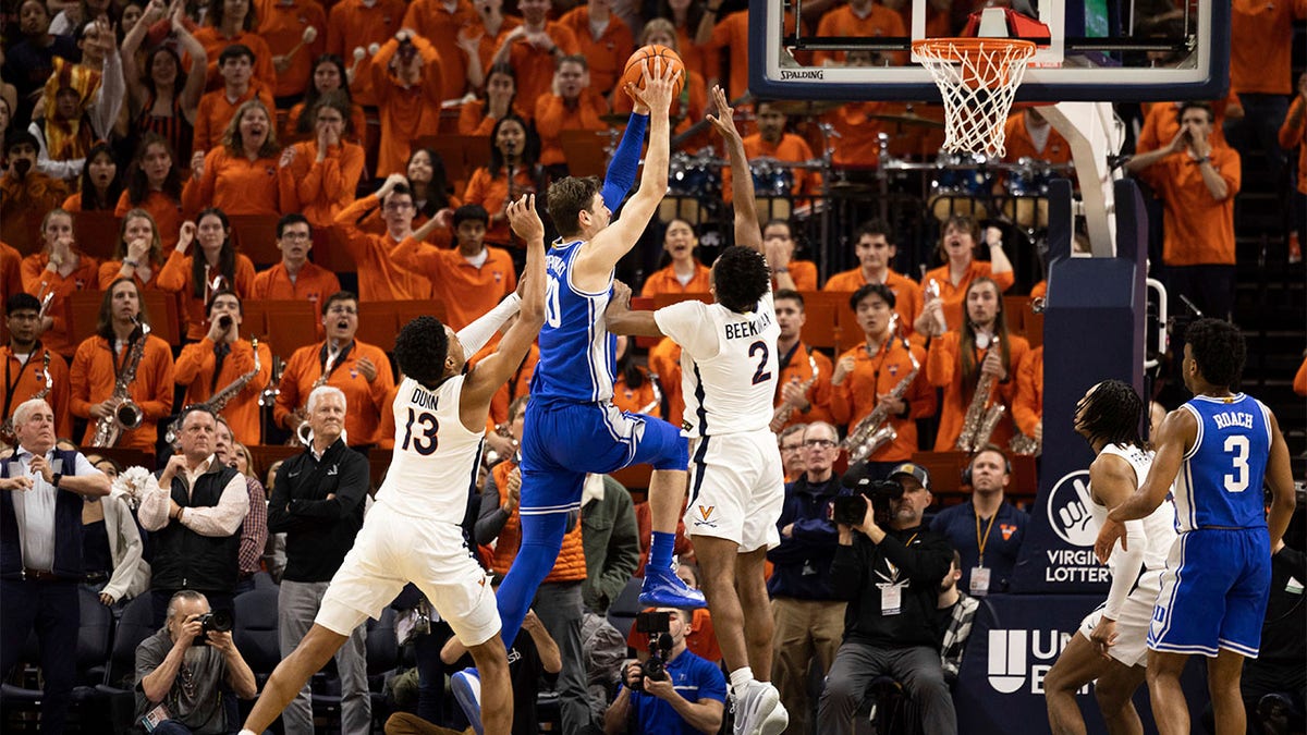 Duke's Kyle Filipowski goes up for a shot against Virginia