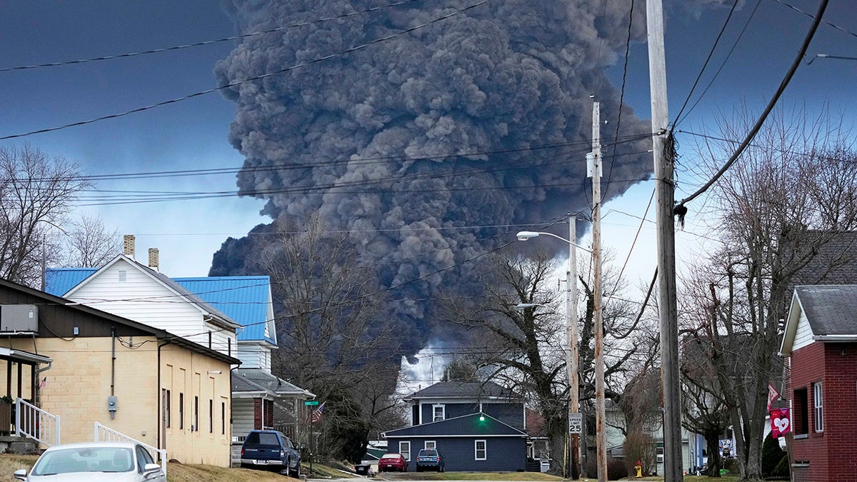 Plume of dark smoke rising from the site of the Ohio toxic train derailment