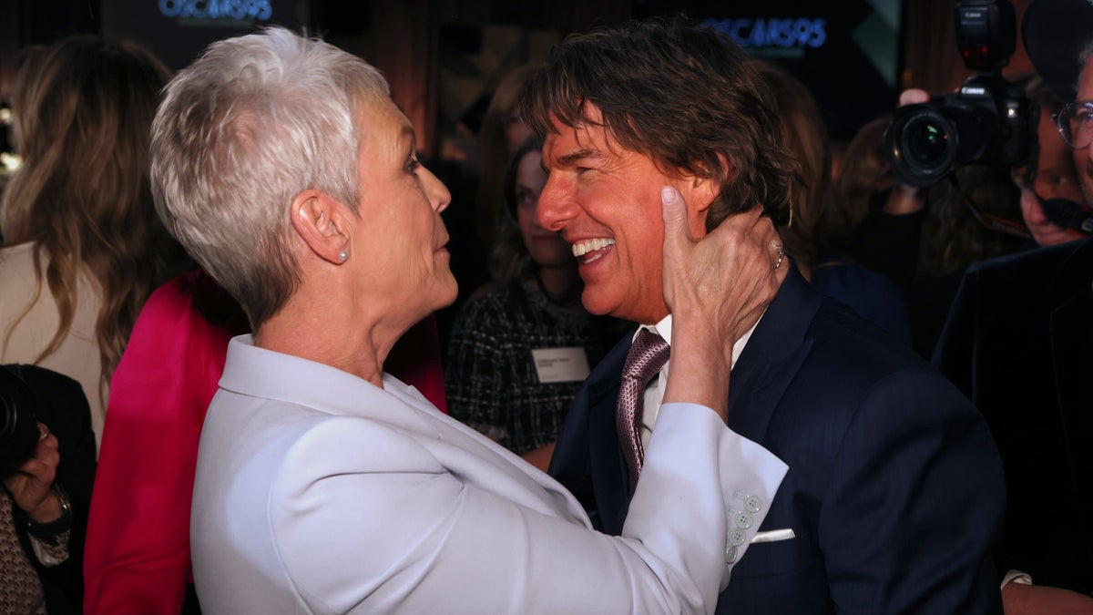 Tom Cruise and Jamie Lee Curtis laughing together