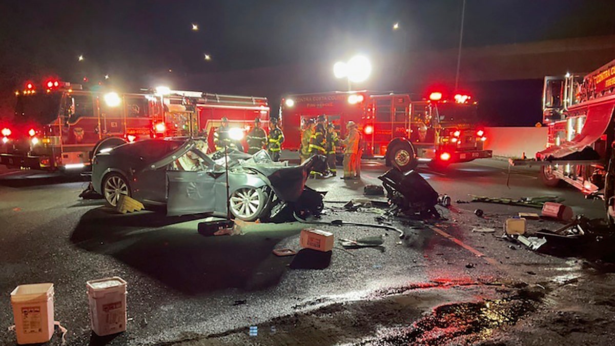 Tesla crashes into fire truck