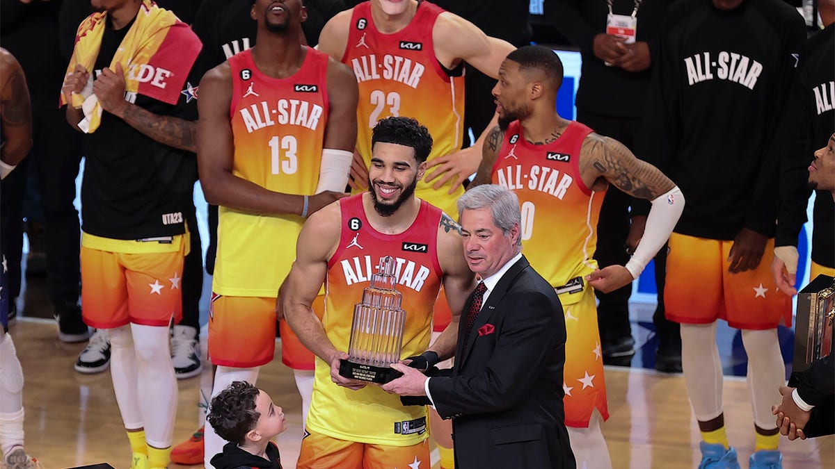 Jayson Tatum receives the All-Star Game MVP trophy