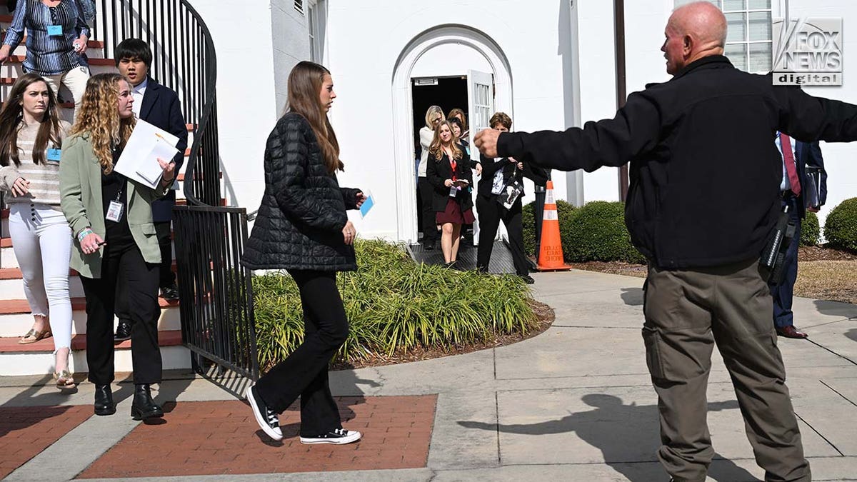 People evacuate a courthouse.