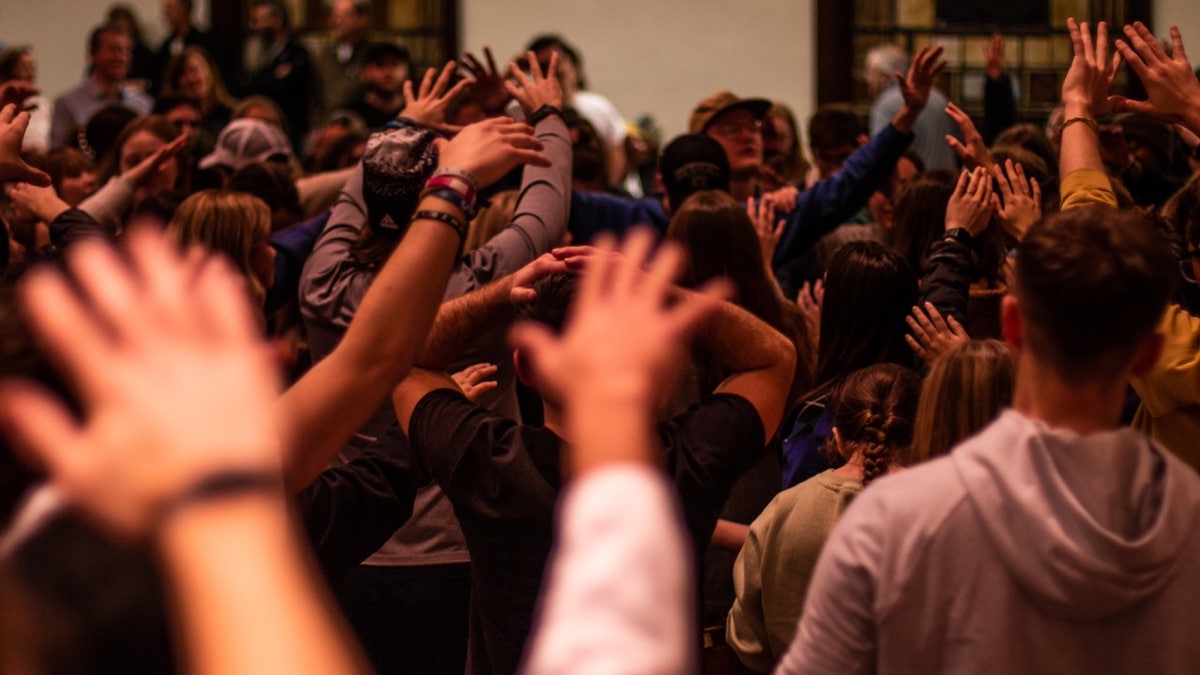 Worshipers praying at Asbury University