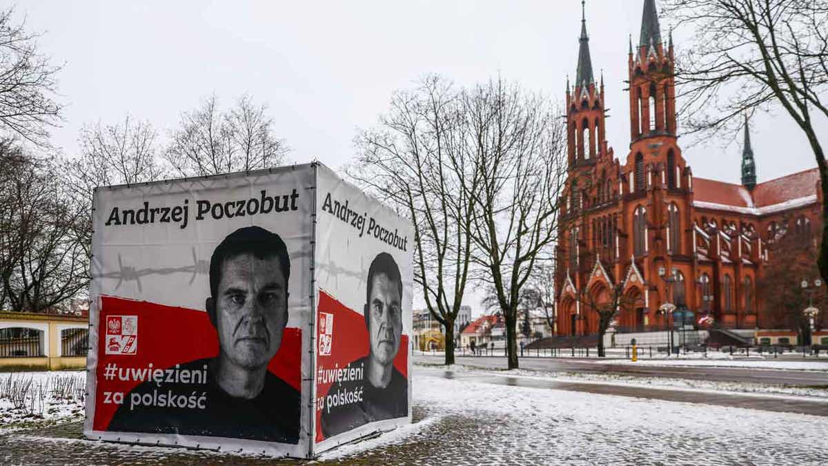 A banner with a picture of Belarusian-Polish journalis