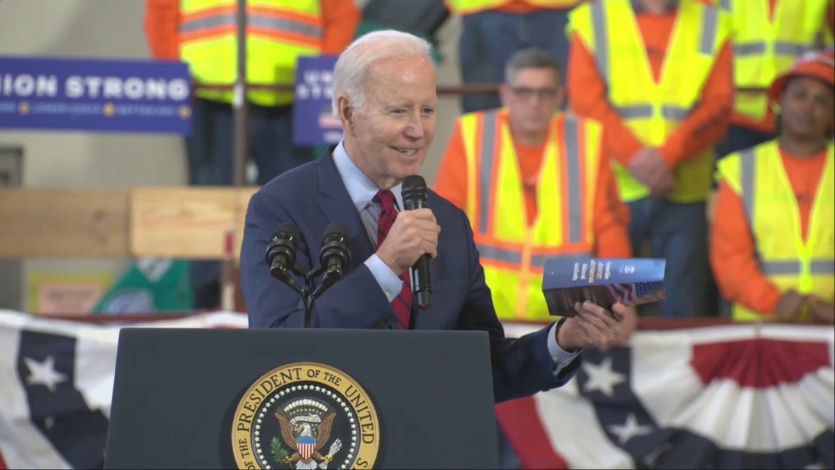 President Biden holds Rick Scott's plan flyer