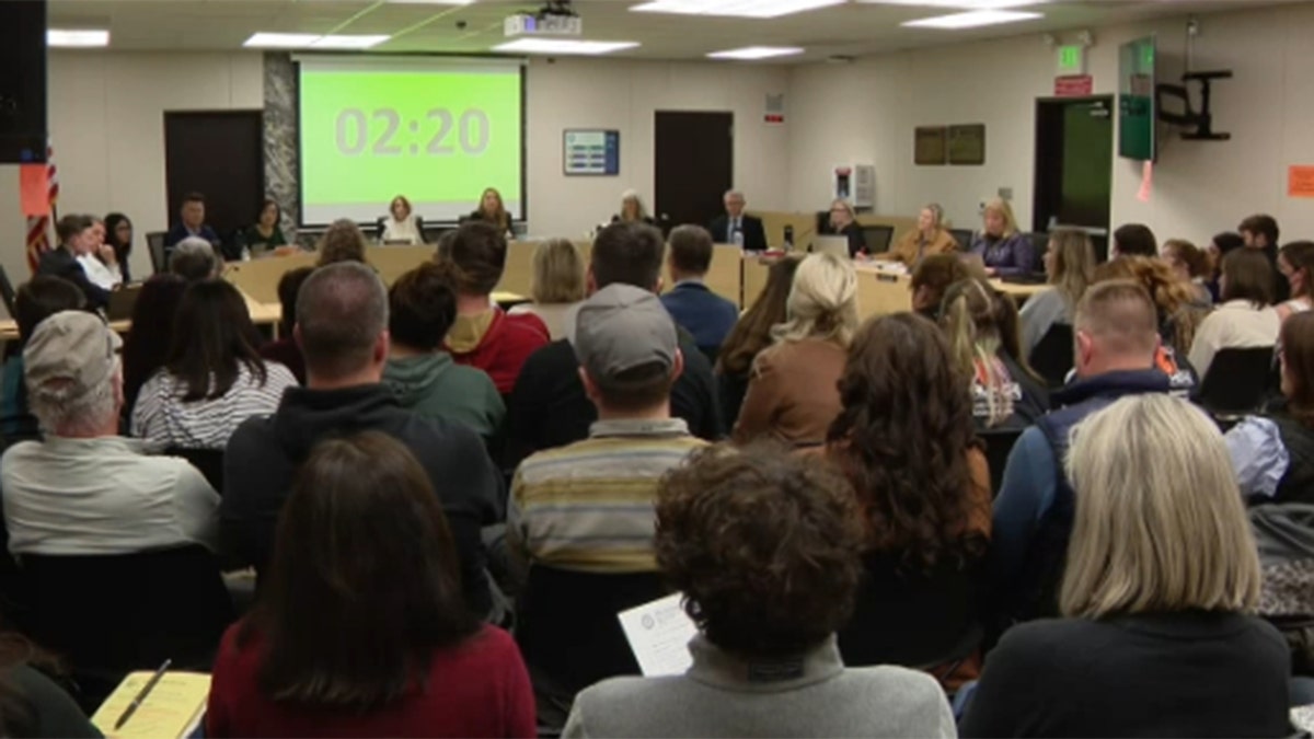 Parents attending school board meeting