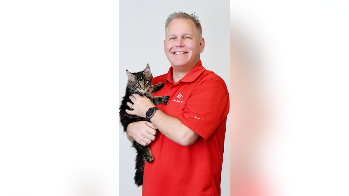 Dr. Brian Hurley of Massachusetts holding a cat