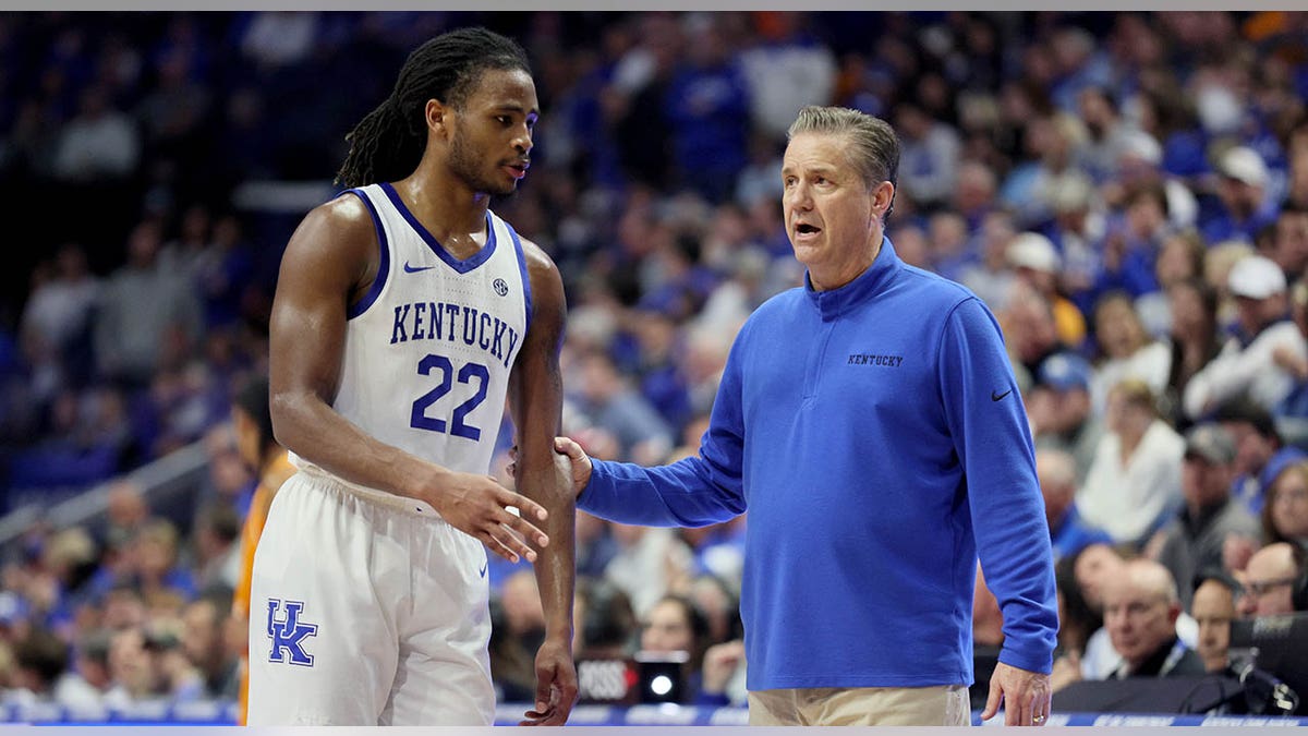 John Calipari talks with his player