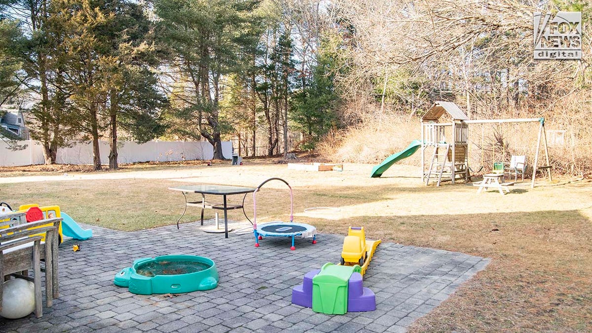 Lindsay Clancy's backyard, filled with children's toys.