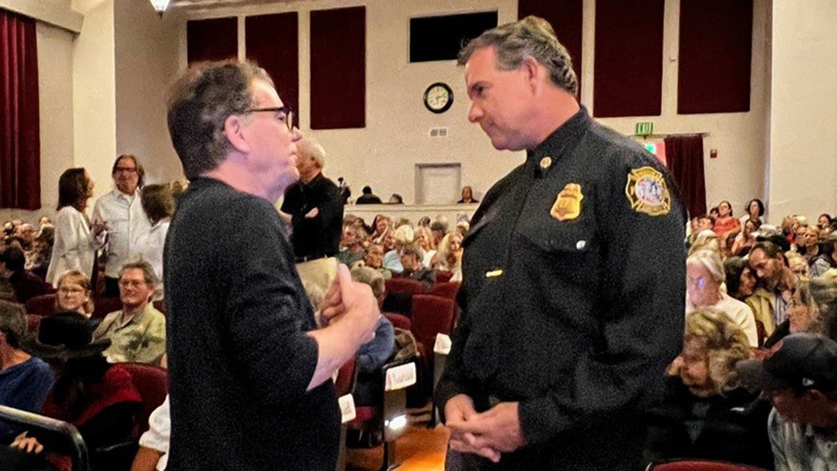 Anson Williams talking to a police officer in Ojai