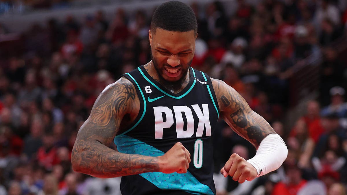 Damian Lillard flexes on court