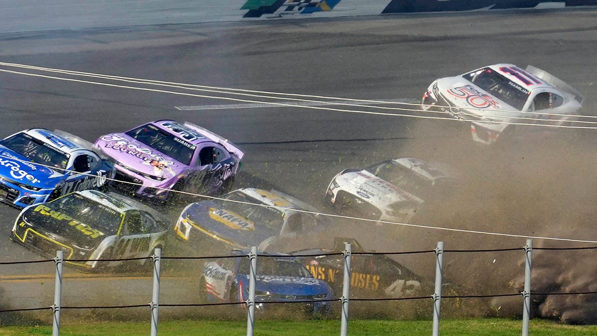 Erik Jones and Kyle Larson in the grass