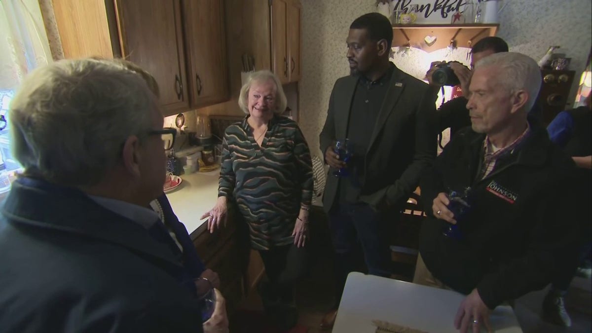 Ohio Gov. Mike DeWine, EPA Administrator Michael Regan and Rep. Bill Johnson are seen drinking water inside a woman's East Palestine home