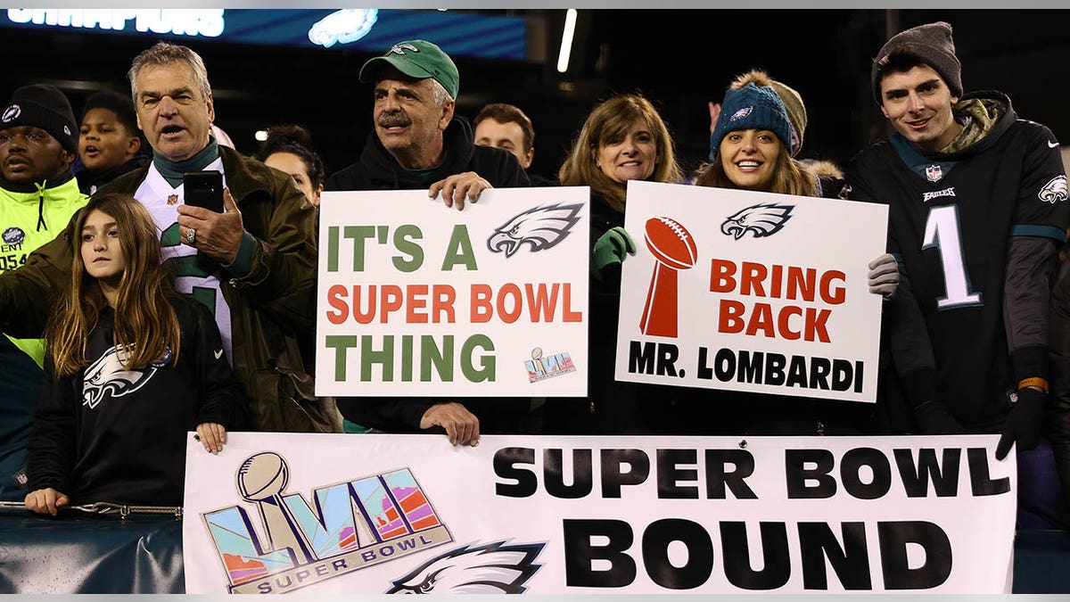 Eagles fans hold Super Bowl Bound signs
