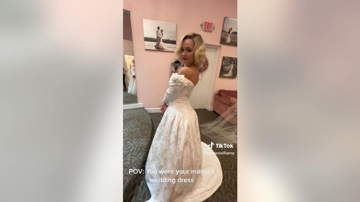 Estee Williams wears her mother's long sleeve wedding gown