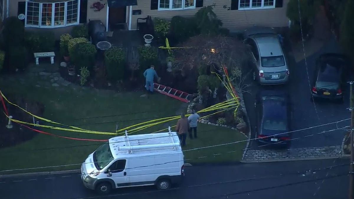 Close-up yard view of Long Island sinkhole