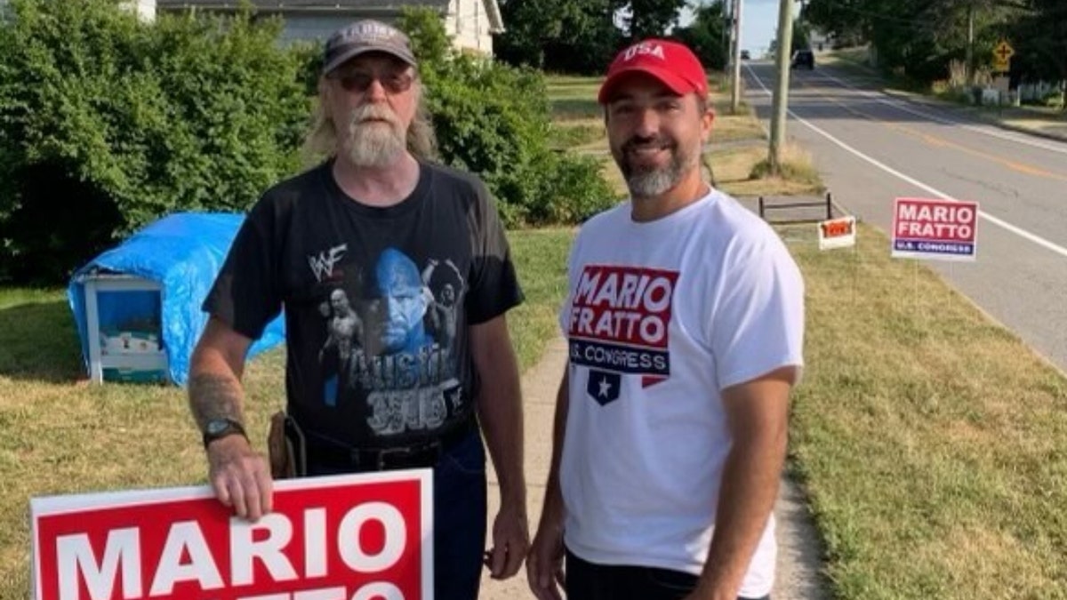 Mario Fratto with supporter