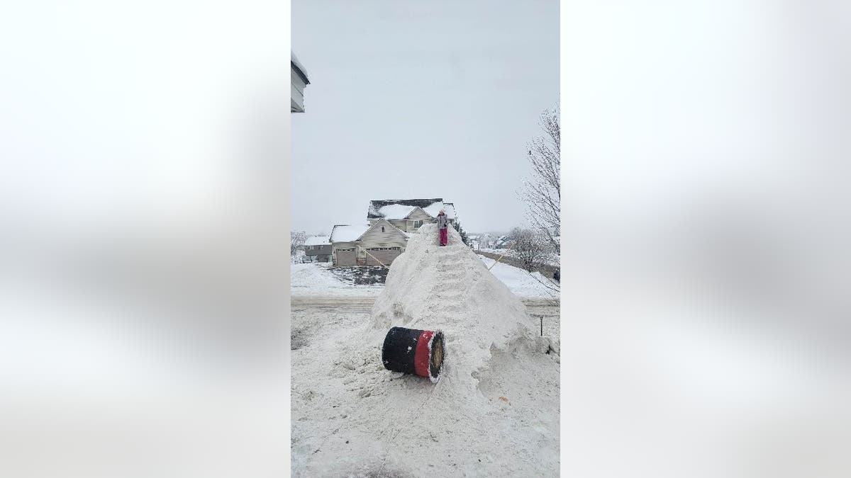 Snow staircase built behind snowman