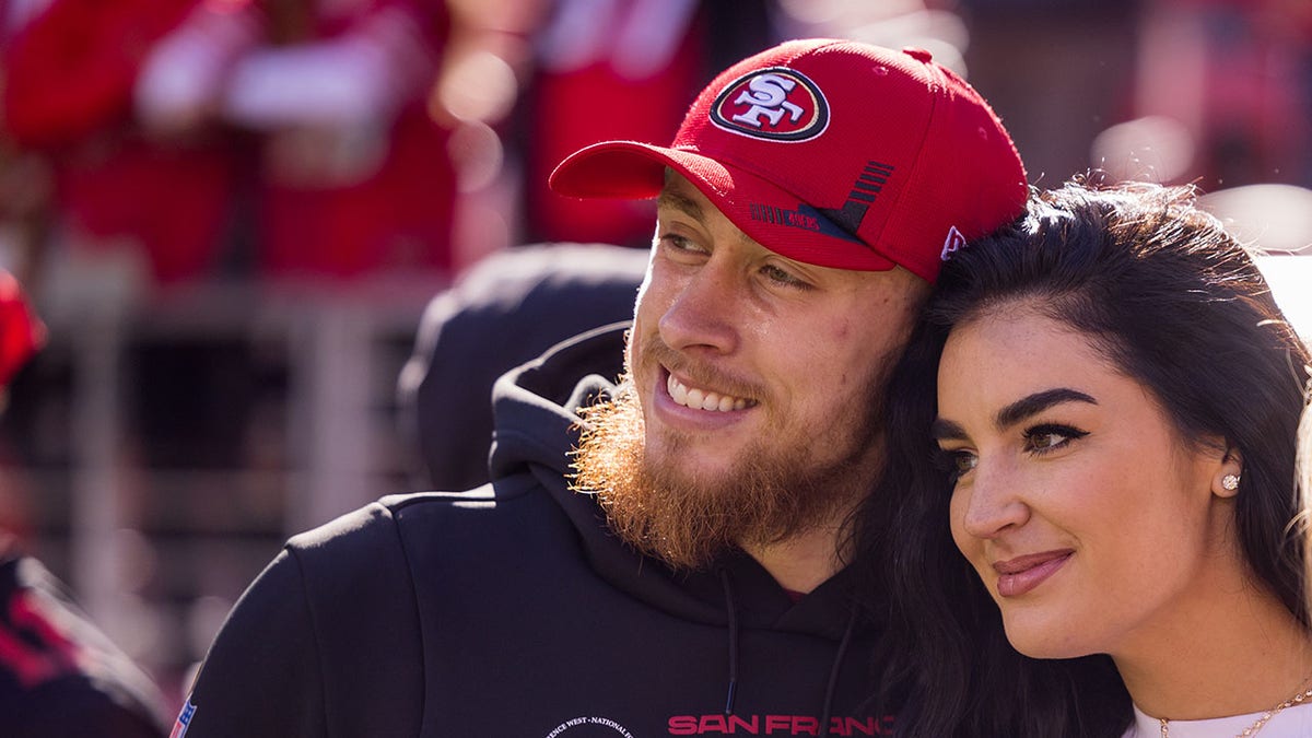 49ers Tight End George Kittle poses with his wife