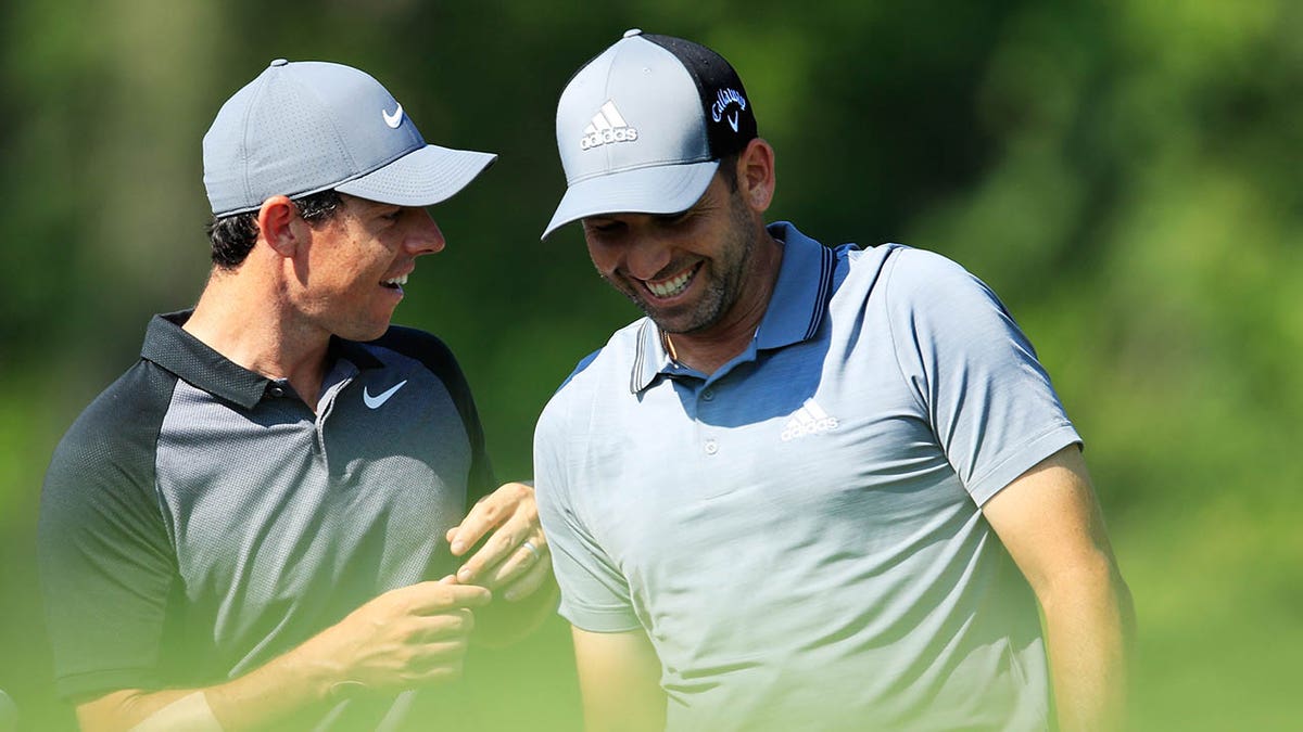 Rory McIlroy talks with Sergio Garcia