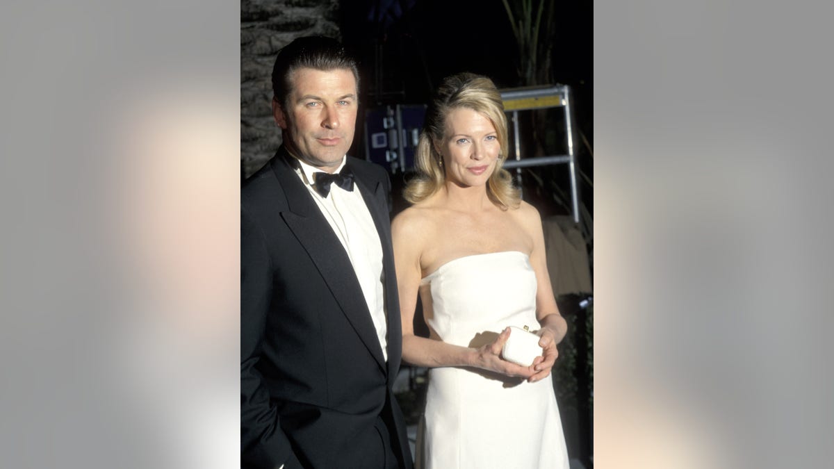 Alec Baldwin and Kim Basinger pose on the red carpet during their marriage