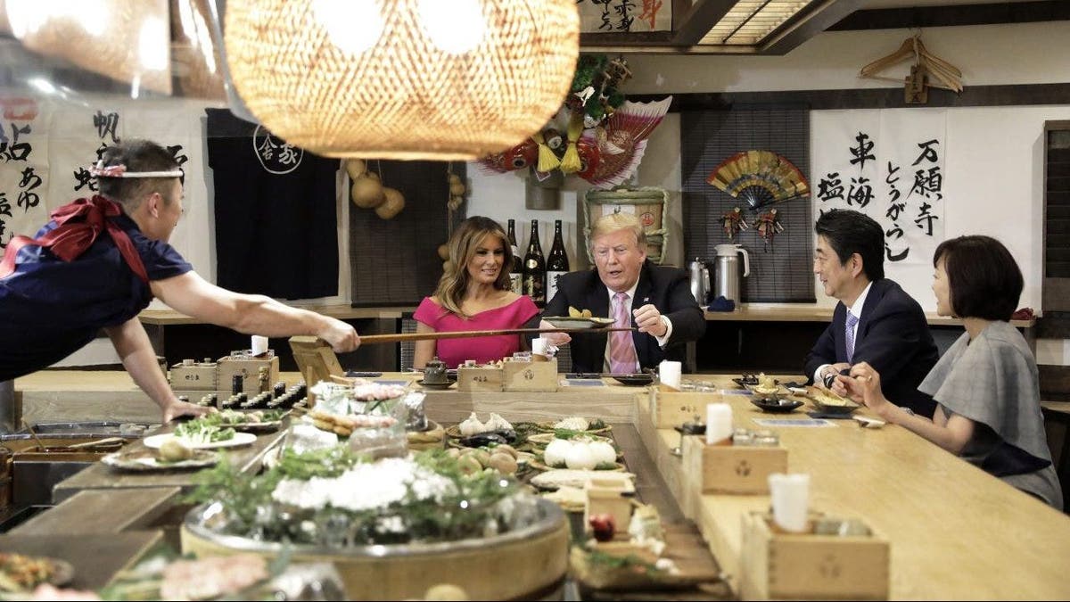 Donald Trump shares a meal with Shinzo Abe