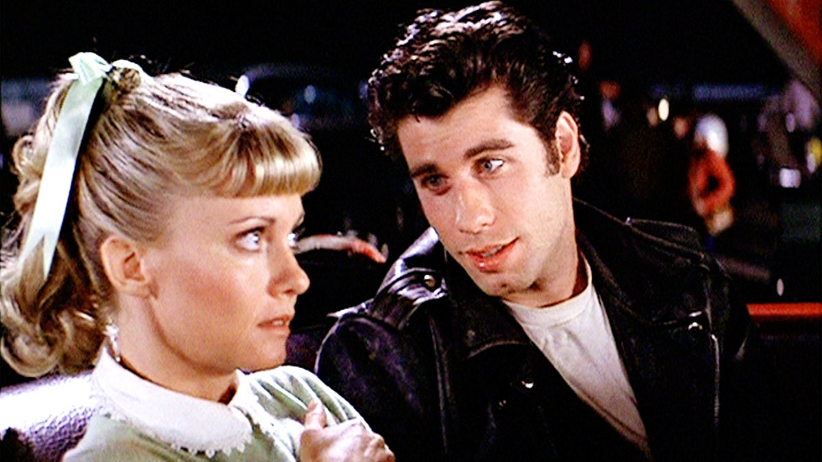 Olivia Newton-John and John Travolta filming the drive-in scene in Grease