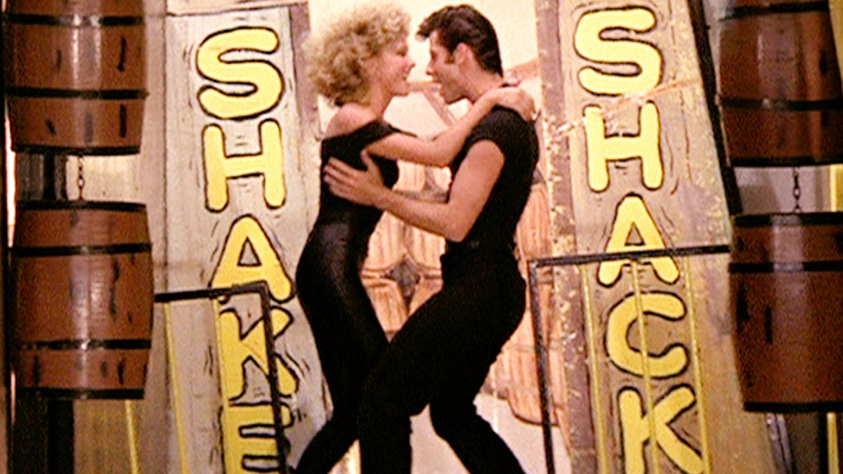 Olivia Newton-John and John Travolta singing "Tou're the one that I Want" in Grease