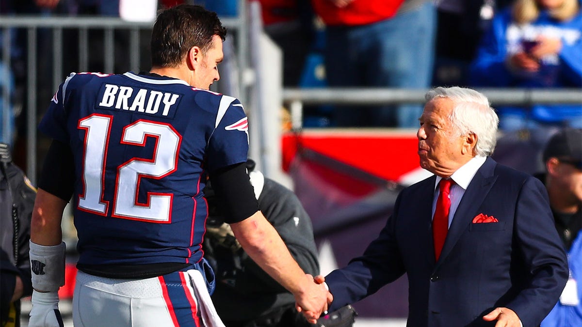 Tom Brady shakes Robert Kraft's hand