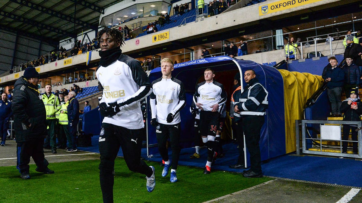 Christian Atsu warms up before a game