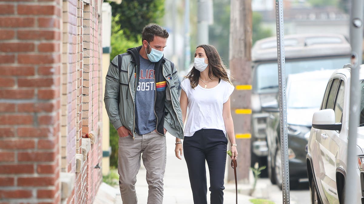 Ben Affleck and Ana de Armas wear masks and walk a dog together
