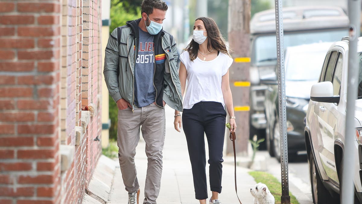 Ben Affleck and Ana de Armas wear masks and walk a dog together