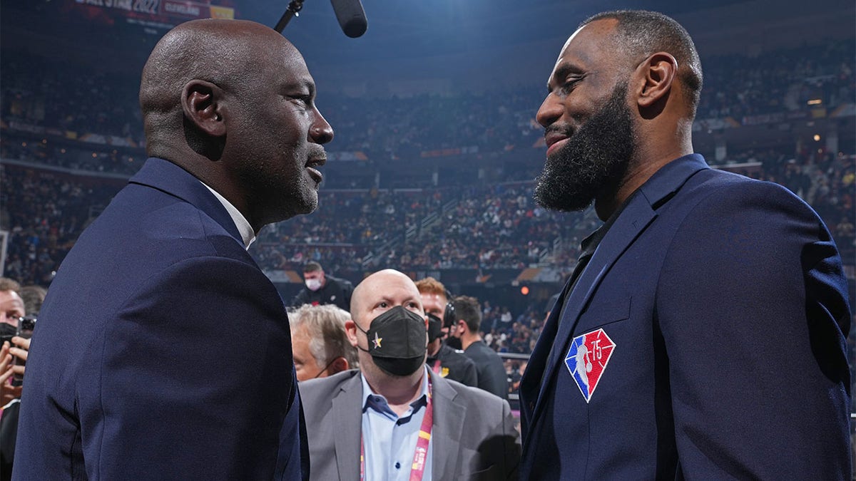 Michael Jordan and LeBron James shake hands