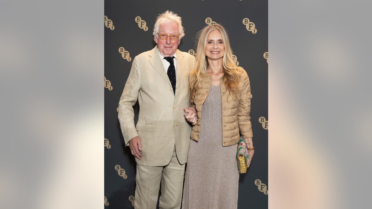 Hugh Hudson and his wife Maryam d'Abo smile at an event