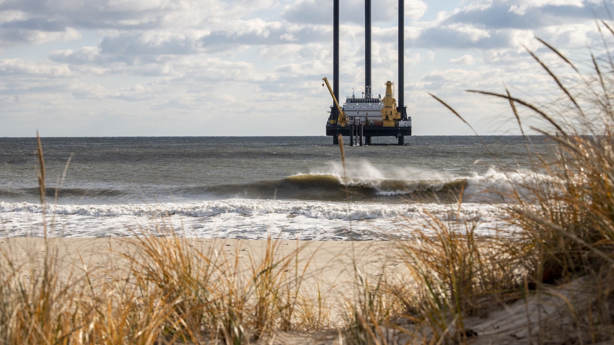 A lift boat off the beach near Wainscott, New York, US, on Thursday, Dec. 1, 2022. The vessel's drill will be used in the construction of the South Fork Wind farm that will bore tunnels to bring electricity from the offshore wind farm that should start generating power?in late 2023. Photographer: Johnny Milano/Bloomberg via Getty Images