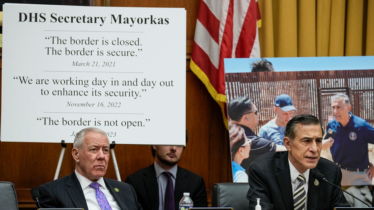 A sign with quotes about the border