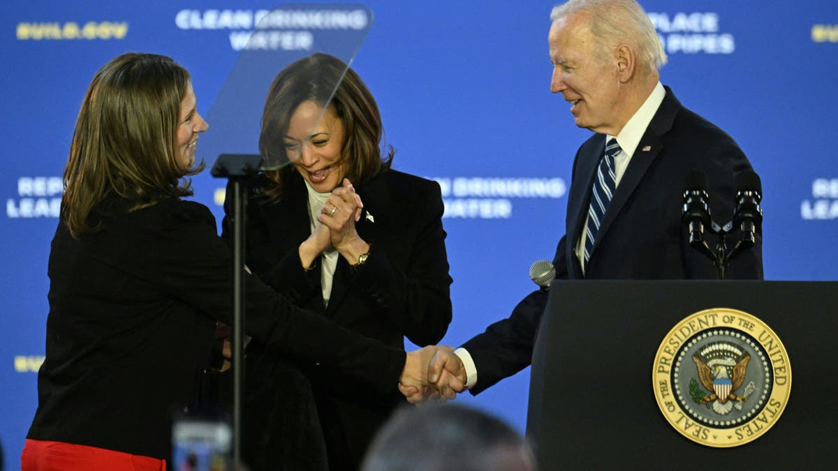 Kamala Harris (C), Jana Curtis (L), Founder of Get the Lead Out Riverwards and US President Joe Biden