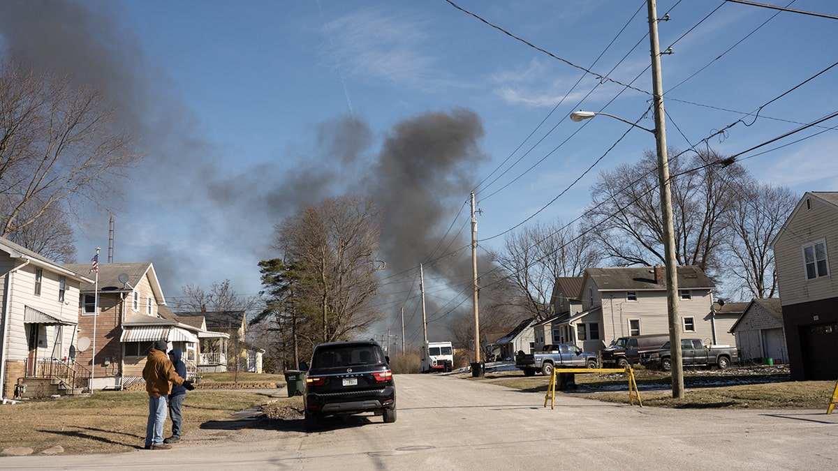 Black smoke over a neighborhood